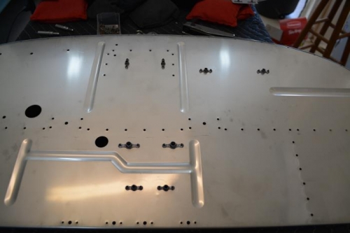 Nut plates attached to fire wall