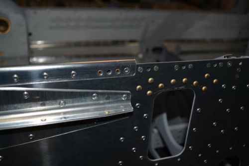 Needed to apply some pressure to get the flange to lay flat prior to setting the rivets