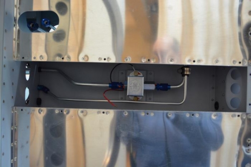 Fuel tank return line shaped into place