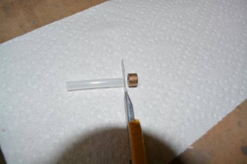 slide tube into bushing and then cut to size with razor