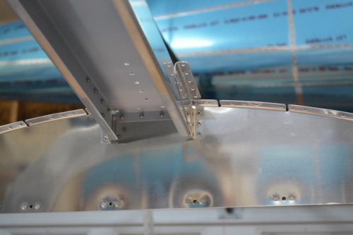 Roll bar brace attached to bulkhead