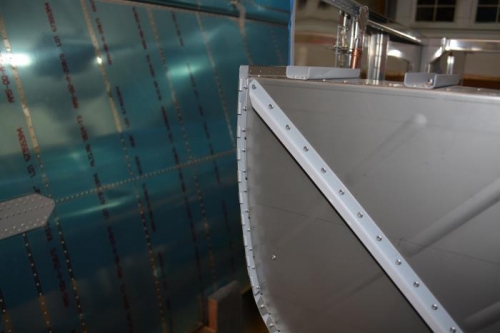 Right cowl hinge installed