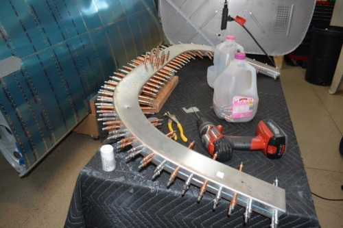 a lot of holes to final size, but much quicker than drilling longerons