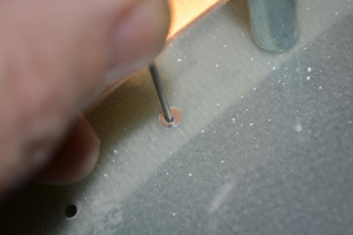 used a small drill and a sacraficial rivet