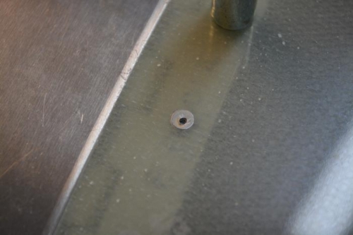 drilled a small hole in head of rivet to be able to remove it