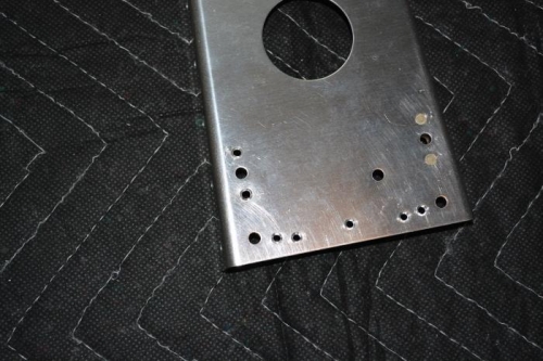 Flush riveted nut plate onto front spar
