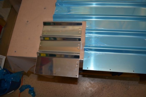 Drill and dimple rear baggage panel