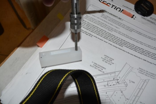 tapping the holes for the guide blocks