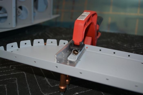 Used a socket to clamp the nutplate bracket while drilling the #30 hole