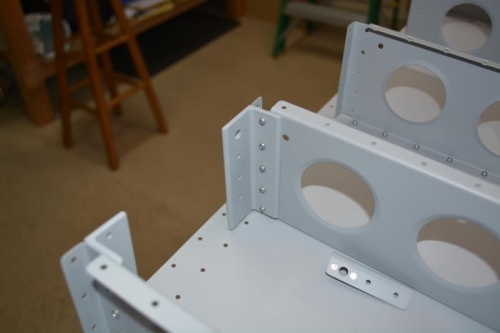 Step angles rivetted in place