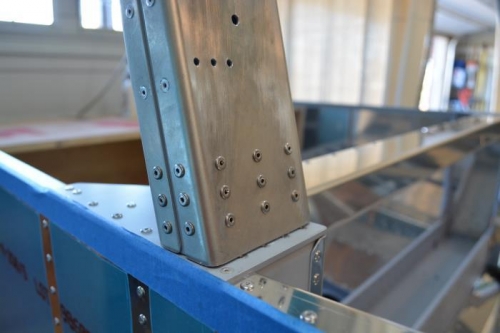 Riveted roll bar to left base