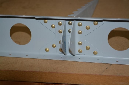 Riveted upper hinge assembly, support and frist rudder rib together