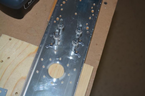 Locate and drill nut plate rivet holes