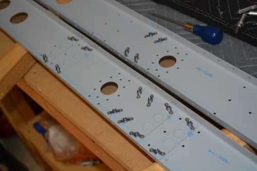 Nut plates riveted in place
