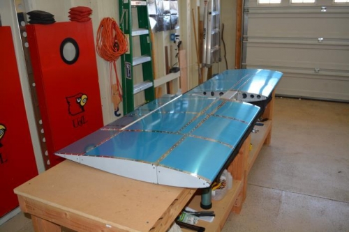 Installing aft stabilator trail edges.