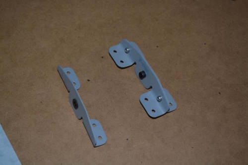 Bulkhead brackets with bushing pressed in place