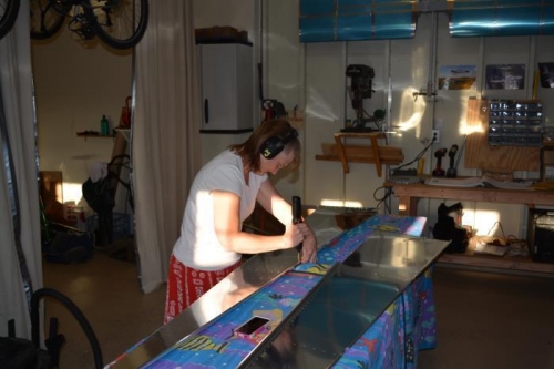 Cyndi helping deburr holes as I ream them to size (hense the ear protection by Cyndi)