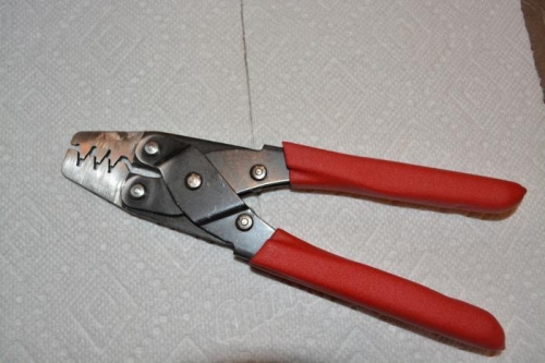 Used bench grinder to thin the cross-section for the small pin size of the trim tab servo