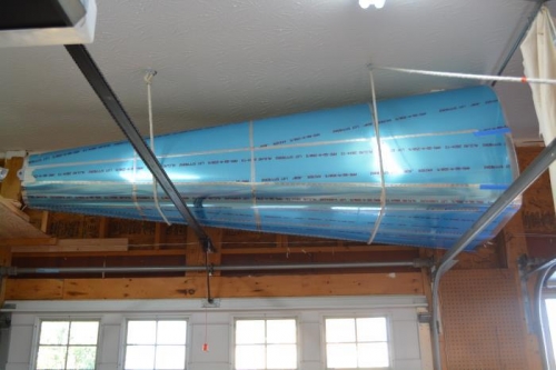 OUt of the way and the garage door still clears and doesn't block any of the lights