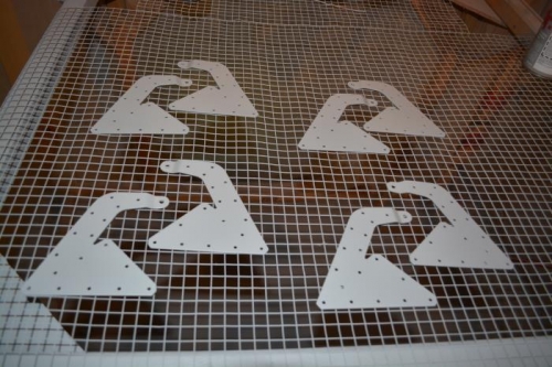 Deburred and primed the hinge bracket assemblies