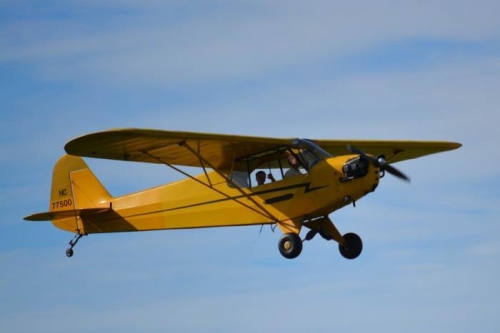 Benjamin waving as he flies by