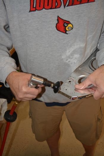 1. carefully grind down the bend on the tab