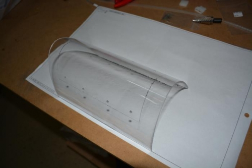 Landing light lens drilled and marked for trimming