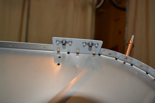 Primed, nut plates attached and riveted in place