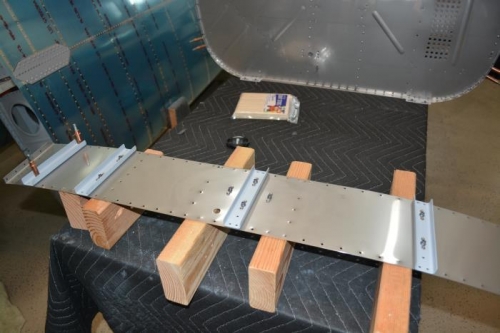 Deburred all parts, primed teh stiffners and attached to shelf