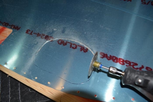 Use cut-off wheel on the dremel to rough out hole shape