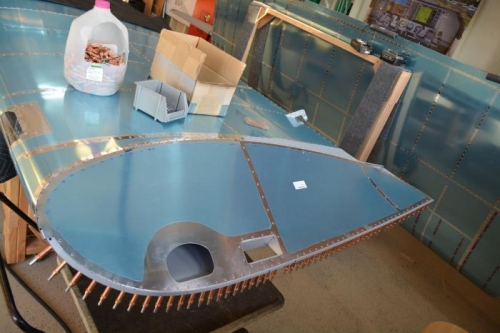 Bottom side riveted in place