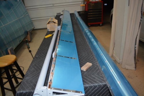 complete with trail edge skin on the left flaperon.