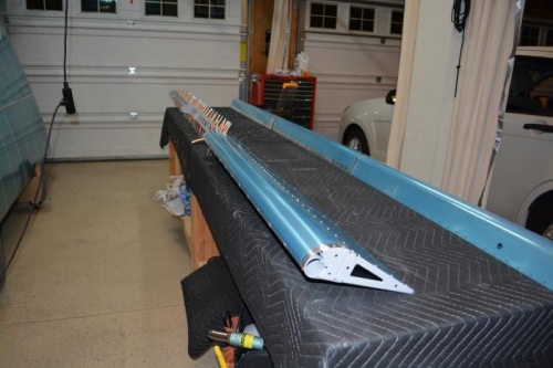 Rivets set on outboard nose skin