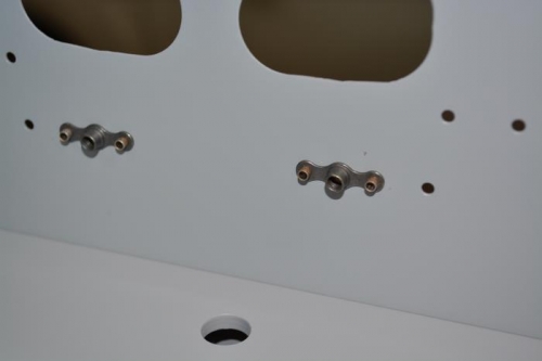 Back side view of pulled flush rivets