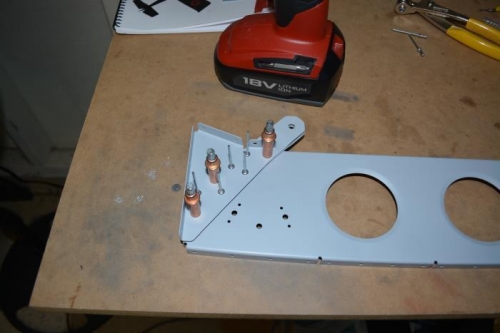 Seat belt bracket clecoed in place