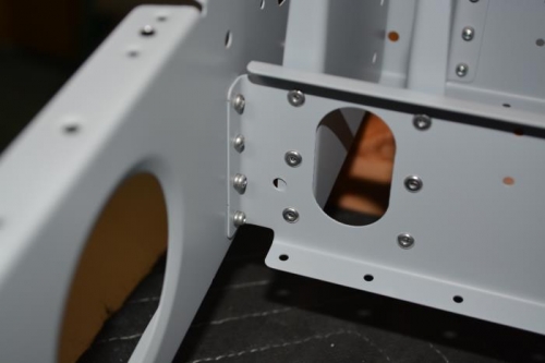 Pulley Bracket riveted to seat ribs