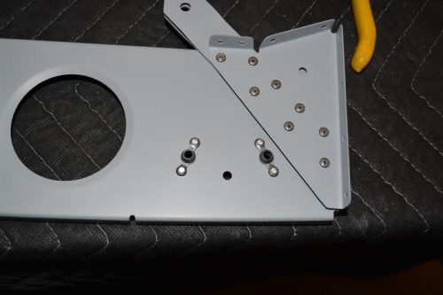 Nut plates added to seat rib