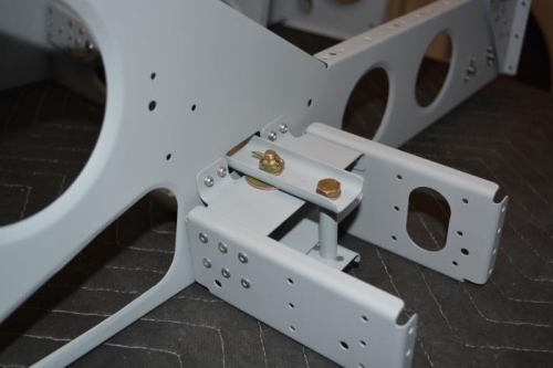 Flaperon mixer attached to seat rib