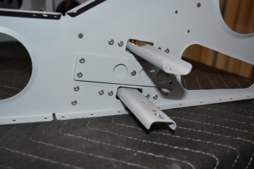 Mixer assembly riveted to seat rib and ready for next step