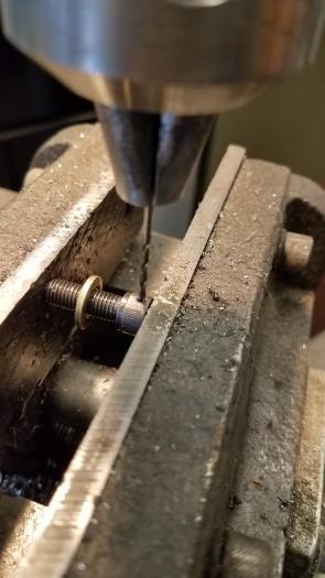 Drill socket cap screw heads for wire tie