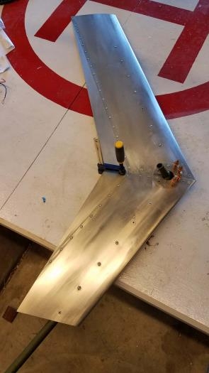 Trim fins mostly riveted