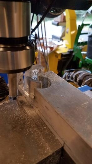 Aluminum bracket being milled