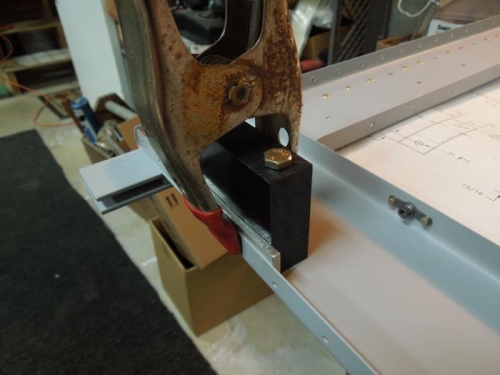 clamp the block in with one hole drilled