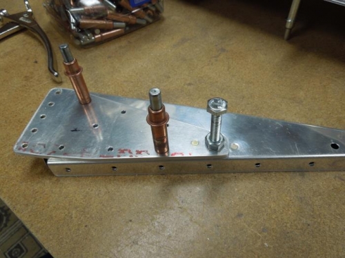 Counter sink on 706A and dimple on rib for nutplate rivets