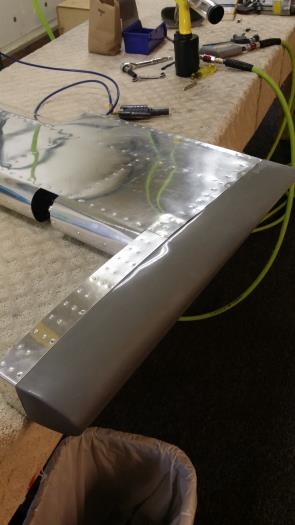 Left elevator end cap