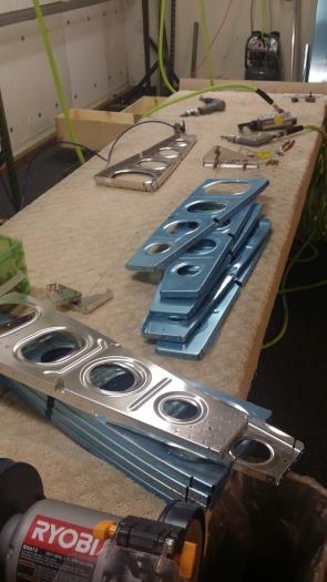 Wing ribs in various stages of prep