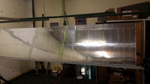 R. wing top skin riveted in place