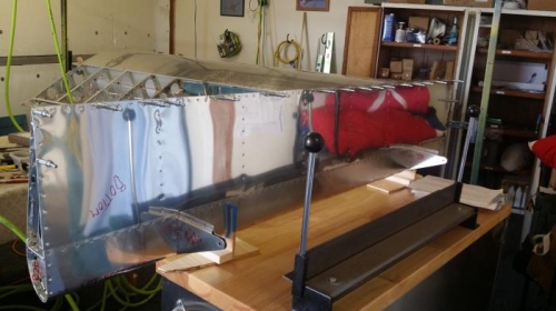 L wing flap mostly riveted