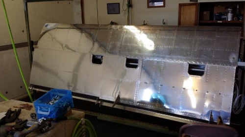R wing bottom skin being rivetedf on