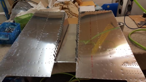 Exhaust tunnel sealed to floor and cleko'd, ready to rivet.Looking at the bottom.